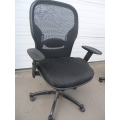 Black rolling office chair with armrest see threw back